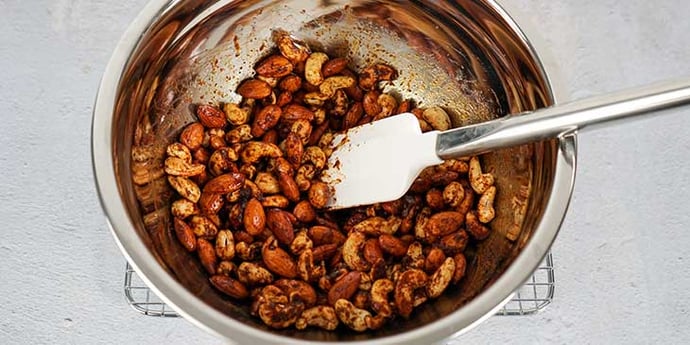 Paleo Roasted Spiced Nuts Recipe add spices to nuts