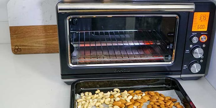 Paleo Roasted Spiced Nuts Recipe roast nuts in Breville oven