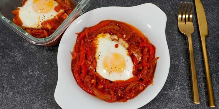 Paleo Shakshouka Breakfast Recipe served on a white plate in a black background