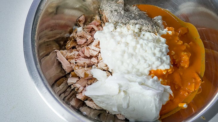 mixing ingredients for buffalo chicken dip recipe 