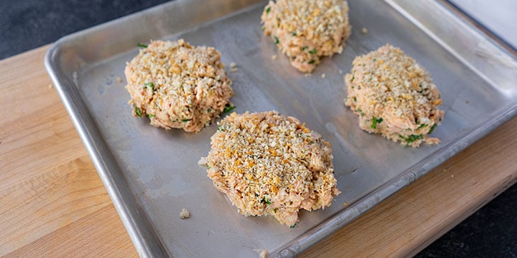 salmon cake patties on sheet tray 