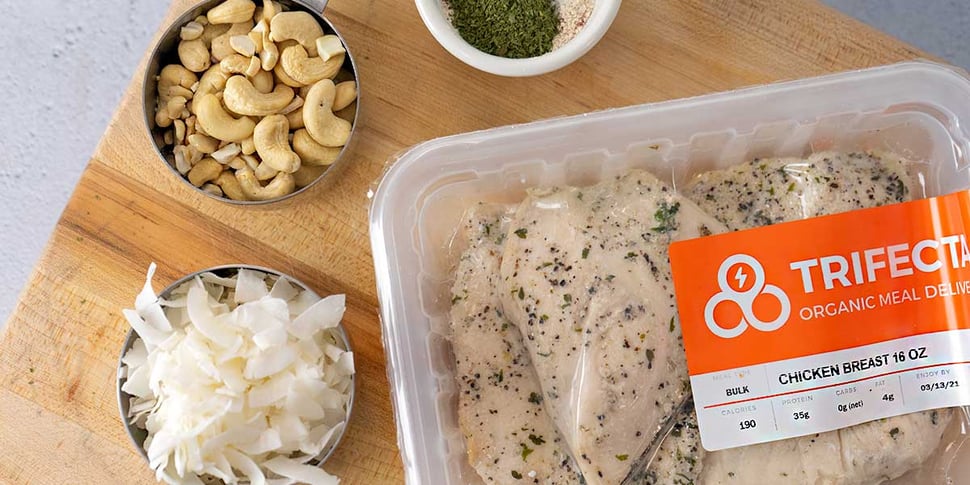 ingredients for keto fried chicken recipe placed on top of a light brown cutting board