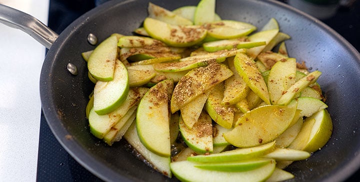 sauting apples and spices for apple crisp recipe 