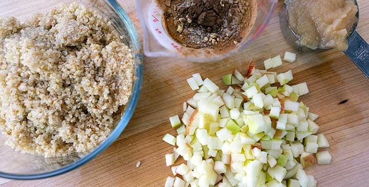 ingredients for  quiona breakfast bowl recipe placed on a wooden board