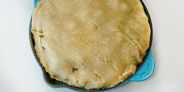 putting crust onto vegan pot pie
