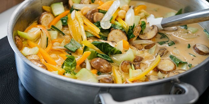 simmering vegetables in thai coconut broth 