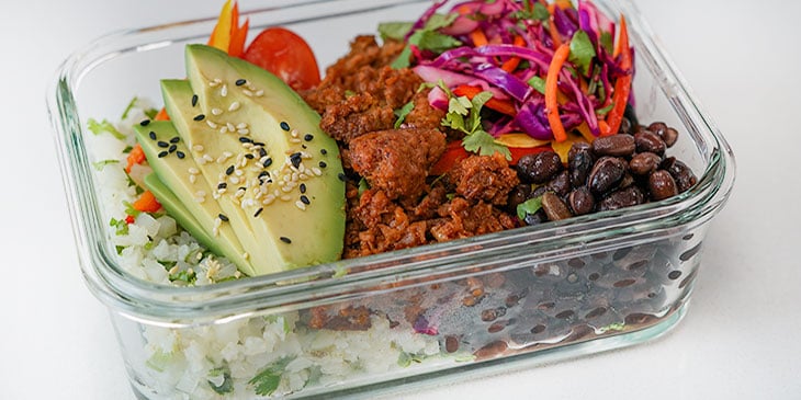 plant-based burrito bowl in meal prep container