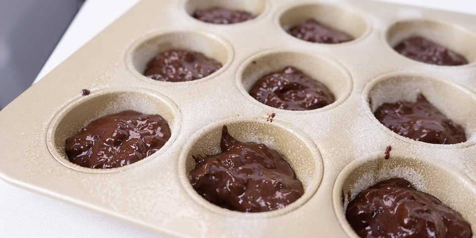 brownie batter in muffin pan 