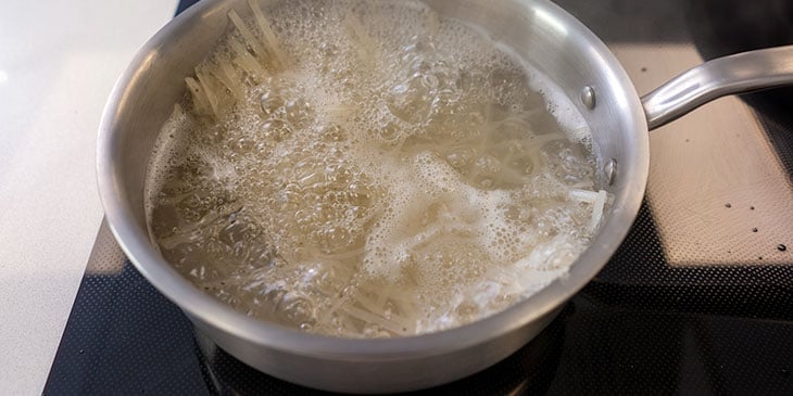 cooking noodles in a pot for meal prep 