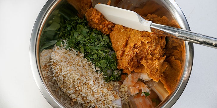 mixing shrimp burger ingredients in bowl 