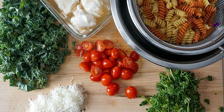 ingredients for shrimp pasta salad on cutting board 