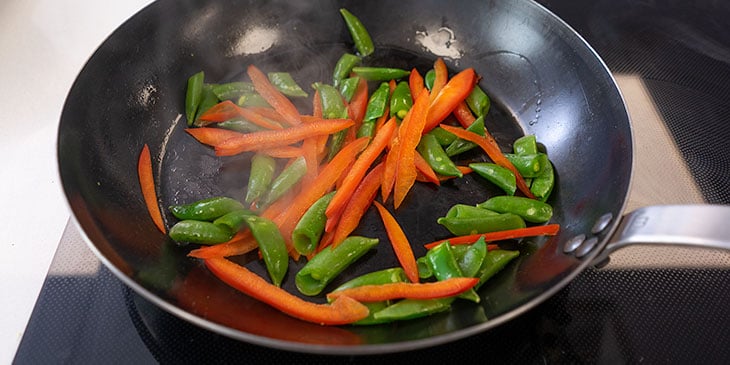 stir fry vegetables in wok for meal prep 
