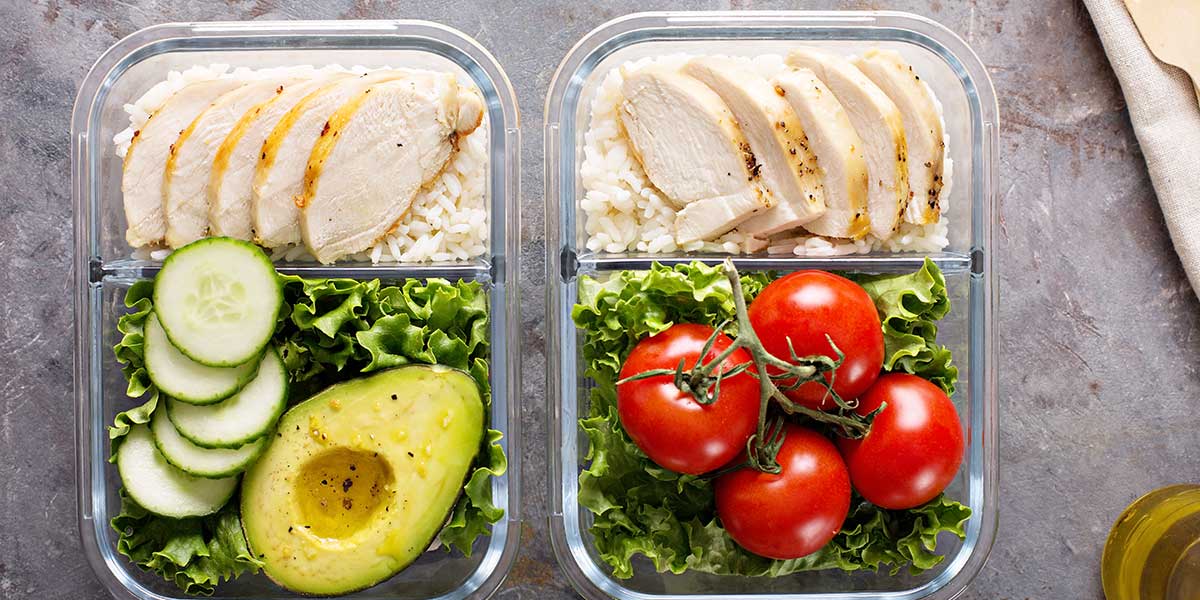 Clean Eating Recipes for Beginners Meal prep containers with chicken rice vegetables and avocado
