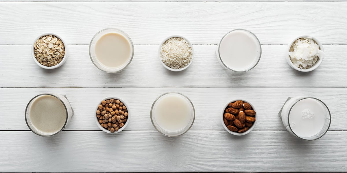Dairy alternatives and ingredients on white tabletop