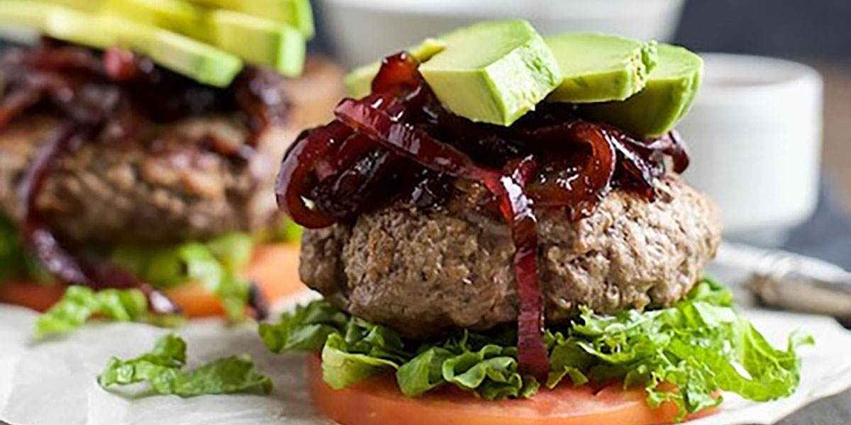 keto-burger-recipe-on a-bunless-and-tomato-base-with-avocado