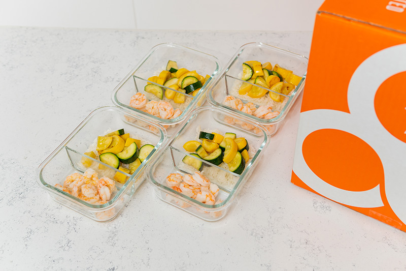 Shrimp, rice, and zucchini in meal prep containers