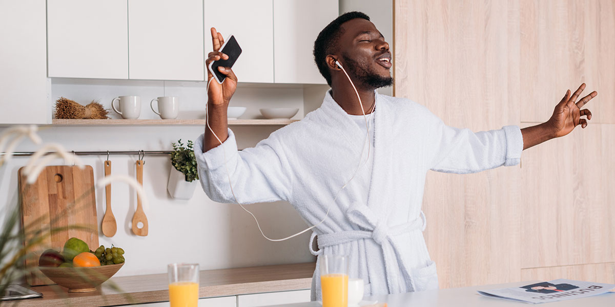 4 Vegan Breakfast Recipes For Plant Based Power. man dancing to music in bathrobe